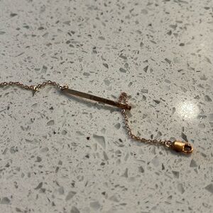 Rose gold bracelet, hammered texture. Monogrammed with an M on the right side